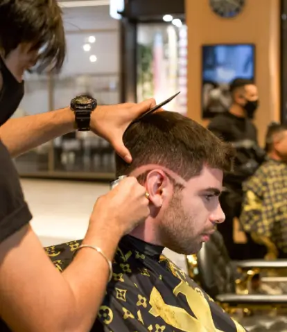 Barber finishing a client's hair